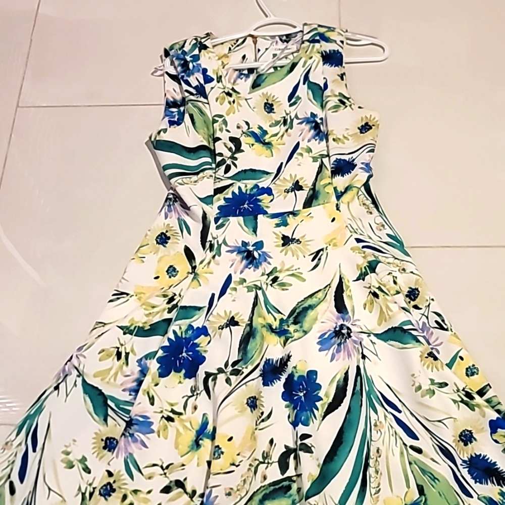 A-line CK dress,  white background with green and blue floral
